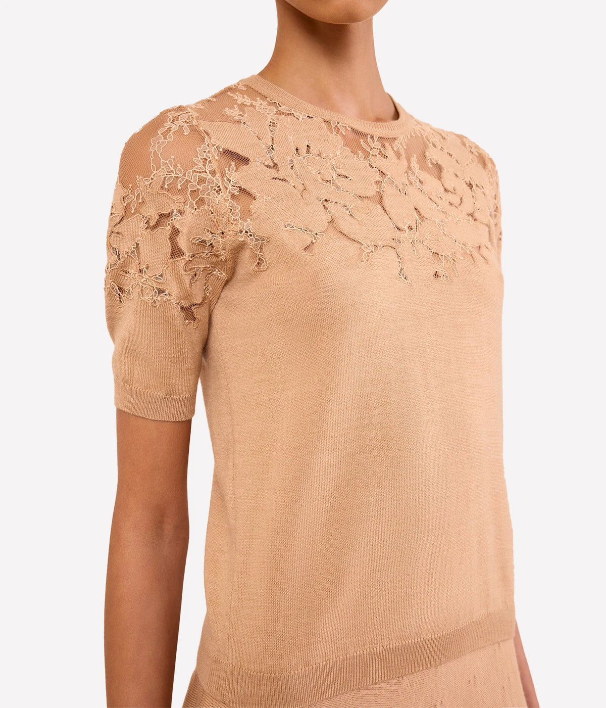 Model wearing Ulla Johnson Ella Short Sleeve Lace Top in Almond, close-up front view