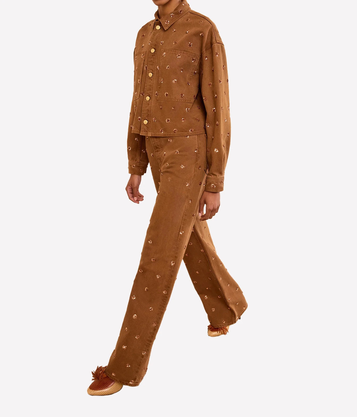 Model wearing Ulla Johnson The Bobbi Embellished Denim Jacket in Umber styled with matching jeans