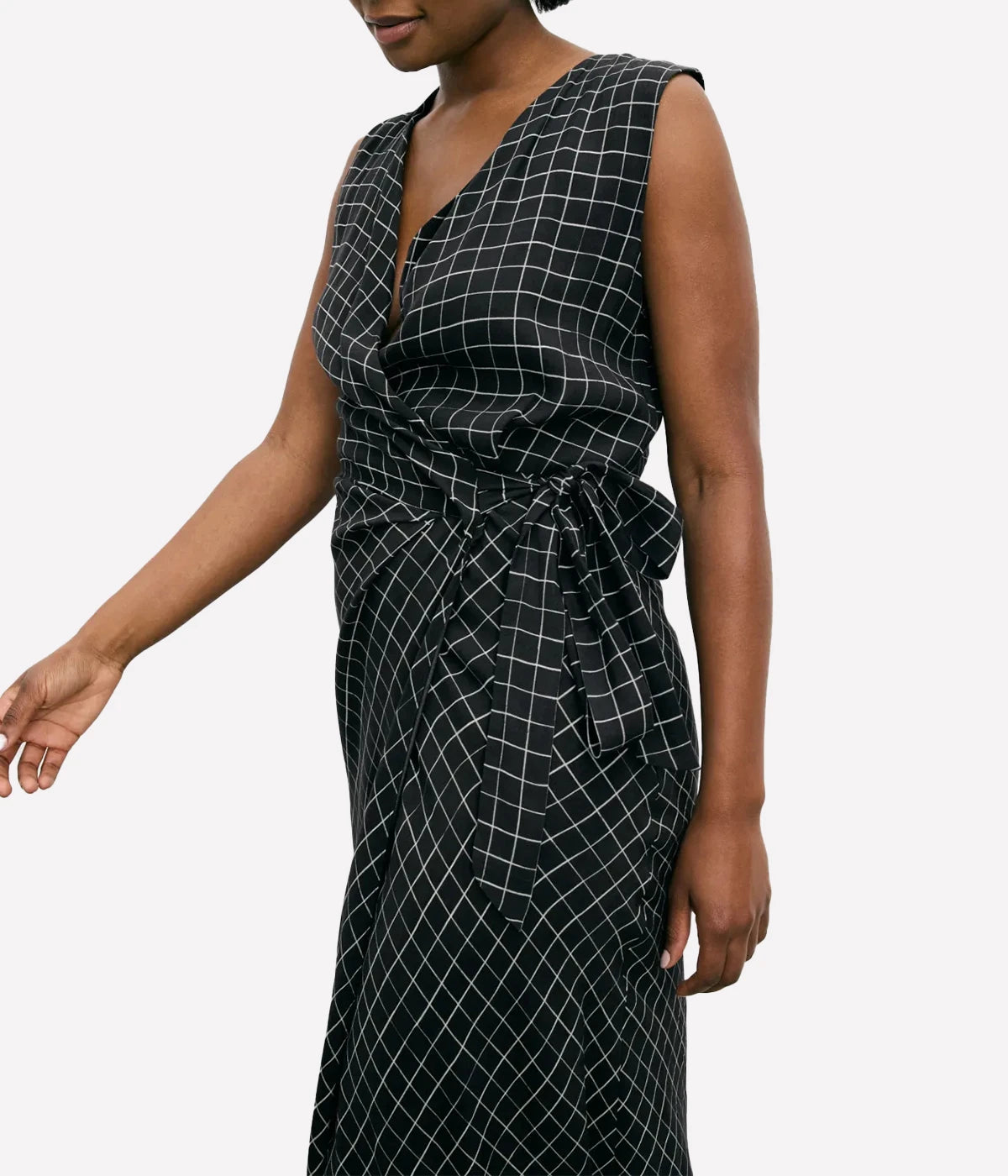 Vince Trellis Wrap Dress featuring pleated crepe fabric in a trellis-inspired check pattern, with a side tie closure and flattering 49" length. Perfect for effortless elegance.