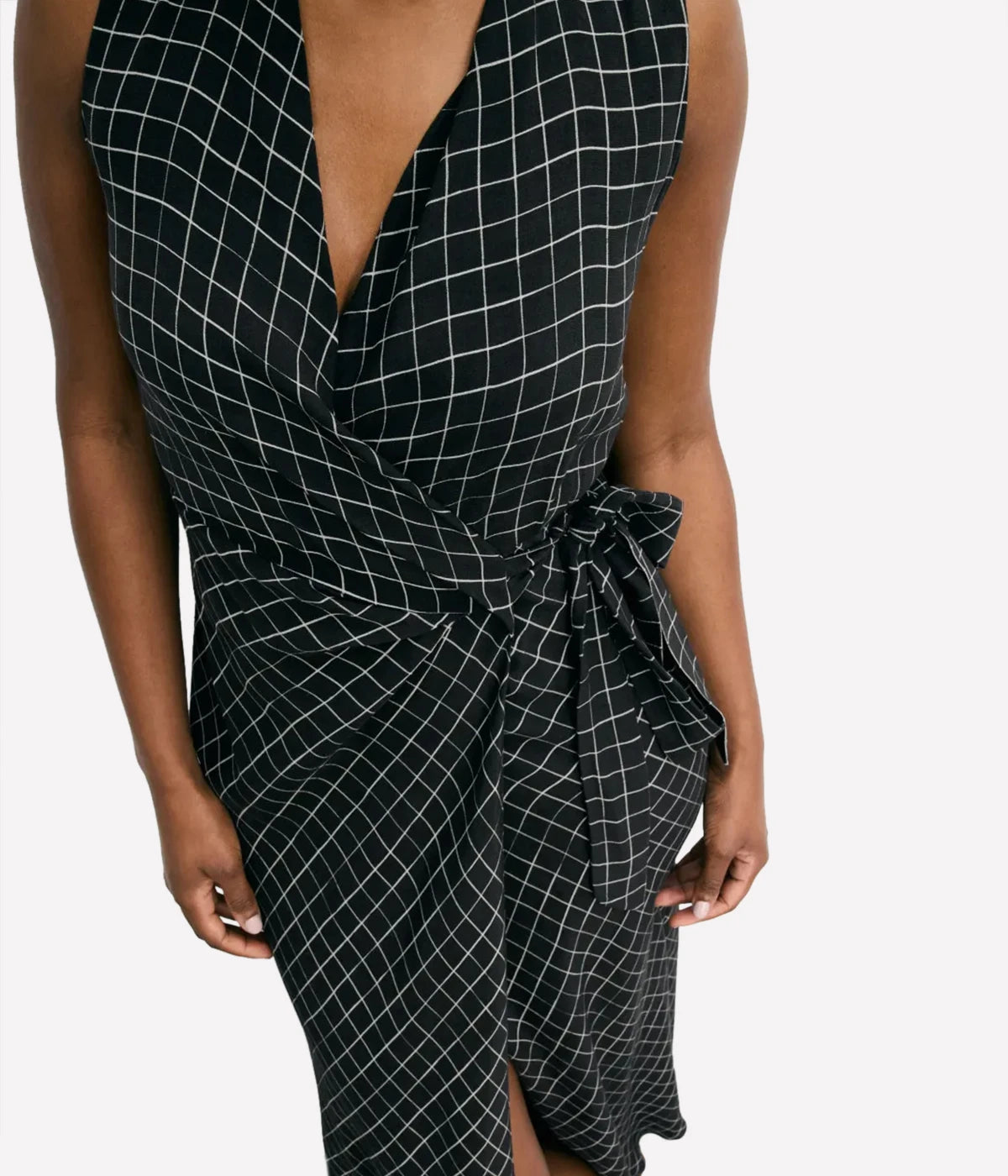 Vince Trellis Wrap Dress featuring pleated crepe fabric in a trellis-inspired check pattern, with a side tie closure and flattering 49" length. Perfect for effortless elegance.