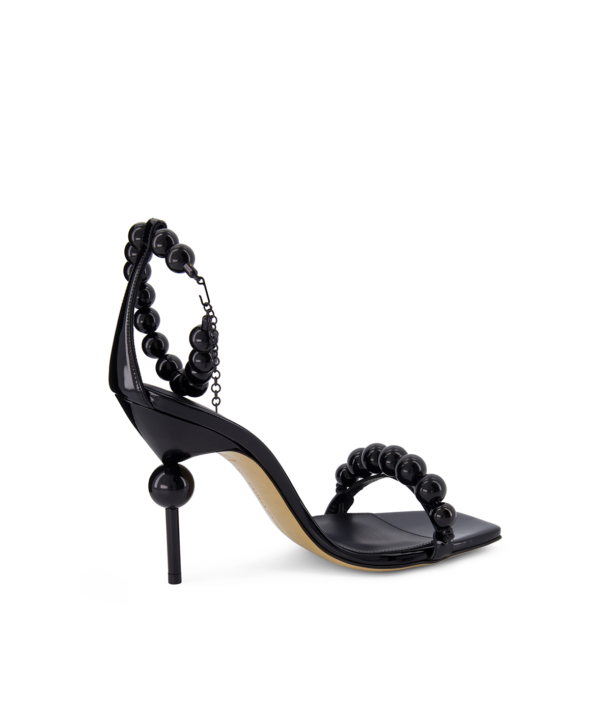 ALT text: CAMILLA GABRIELI Olivia Necklace Sandal 105 with bold black sphere embellishments, a 105mm heel, and an adjustable ankle strap.