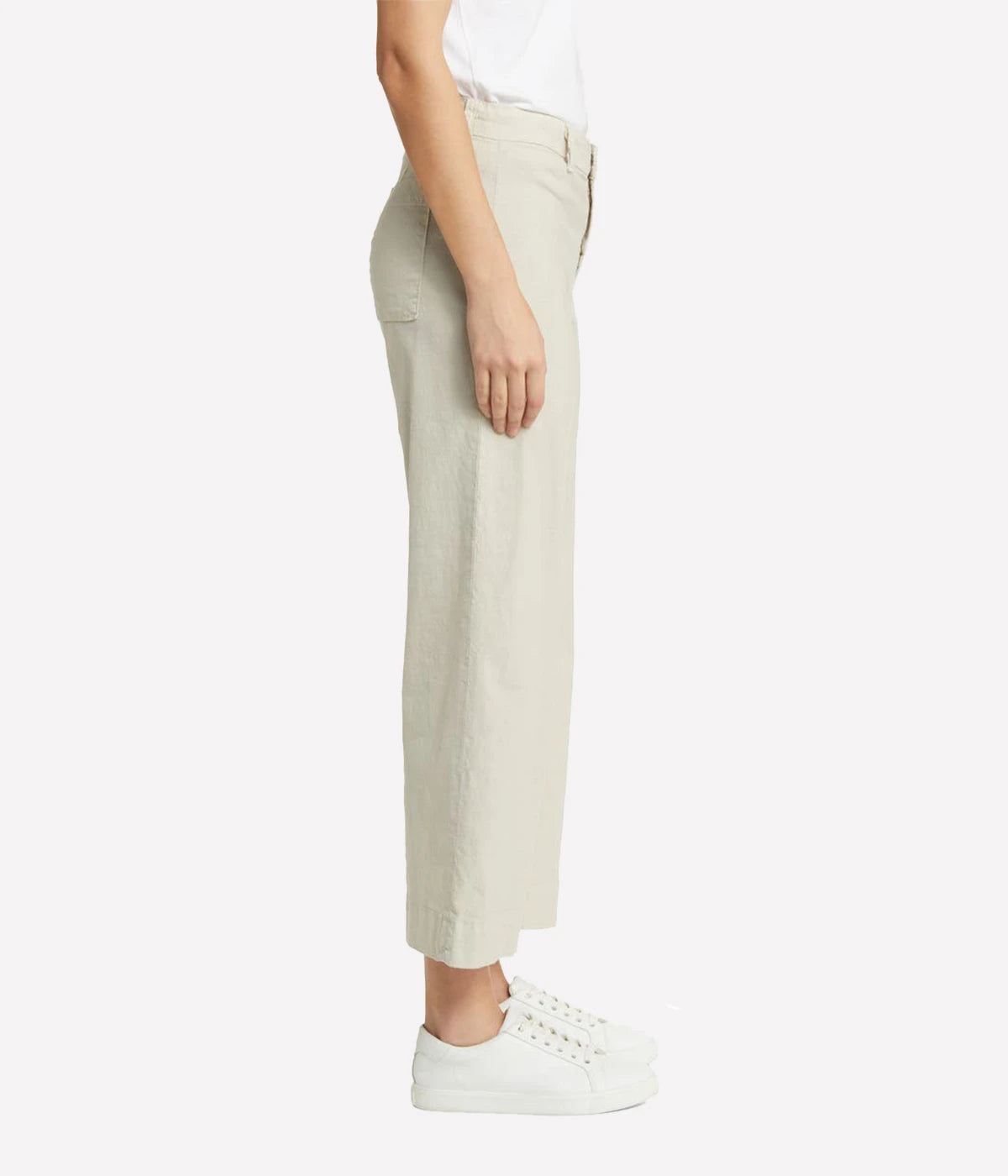 High-rise, wide-leg linen pants with a cropped hem and clean design, styled with a silk blouse and heels for a polished look.