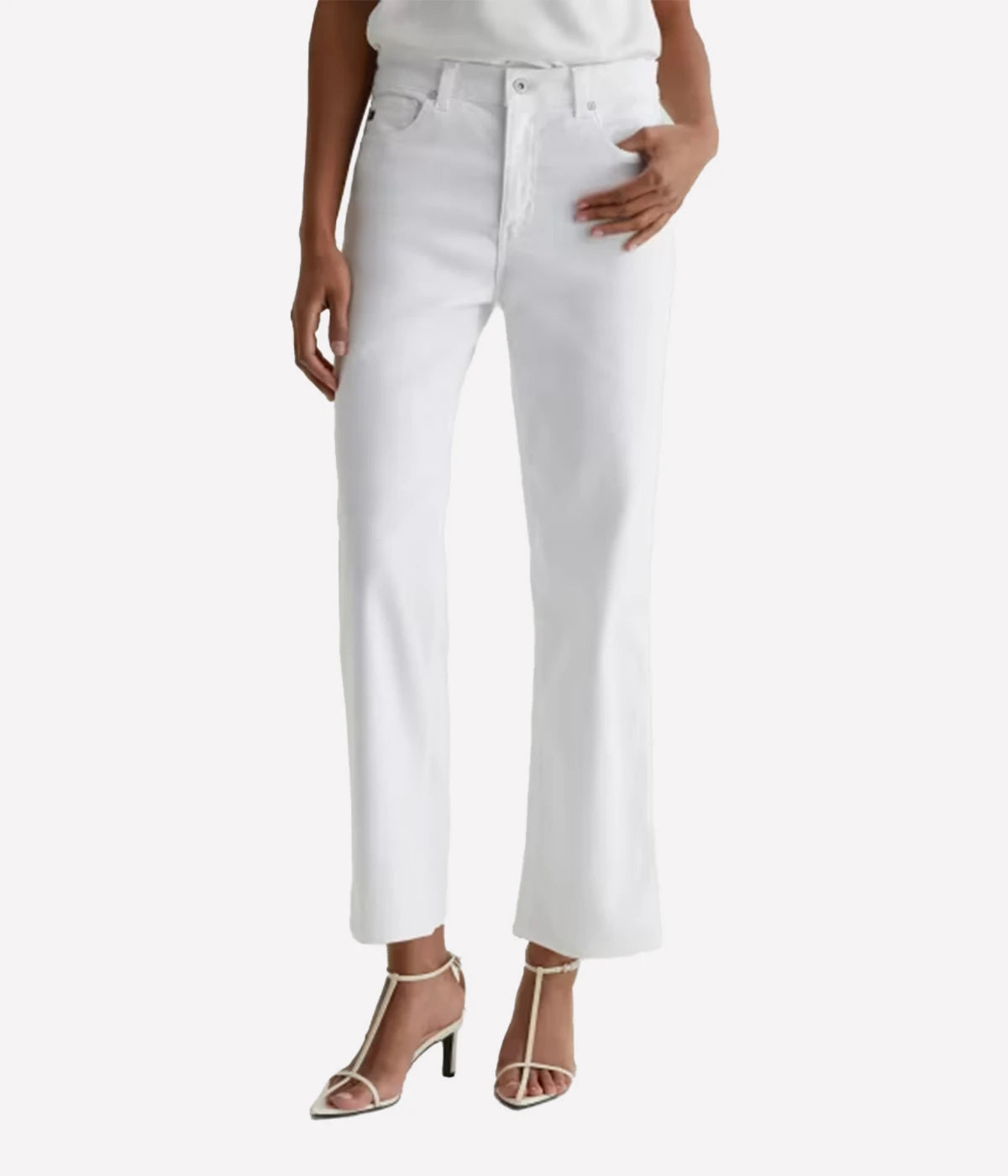 White jeans worn by a person on a white background