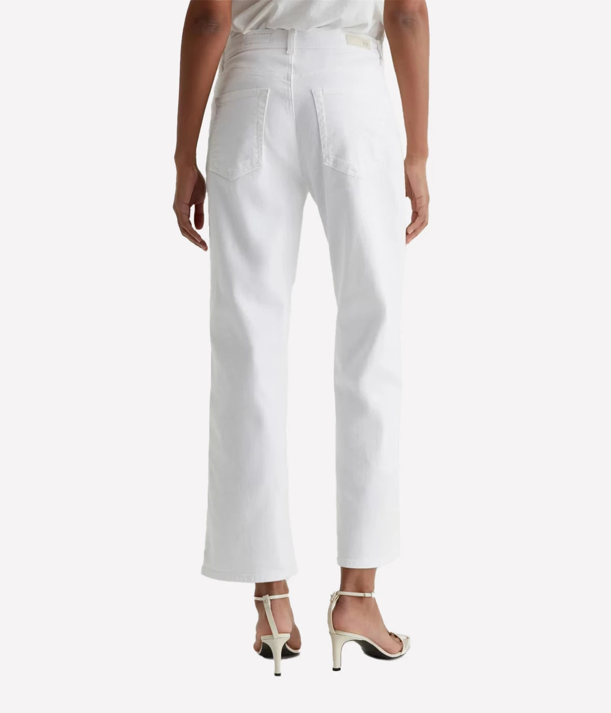 Person wearing white pants on a white background