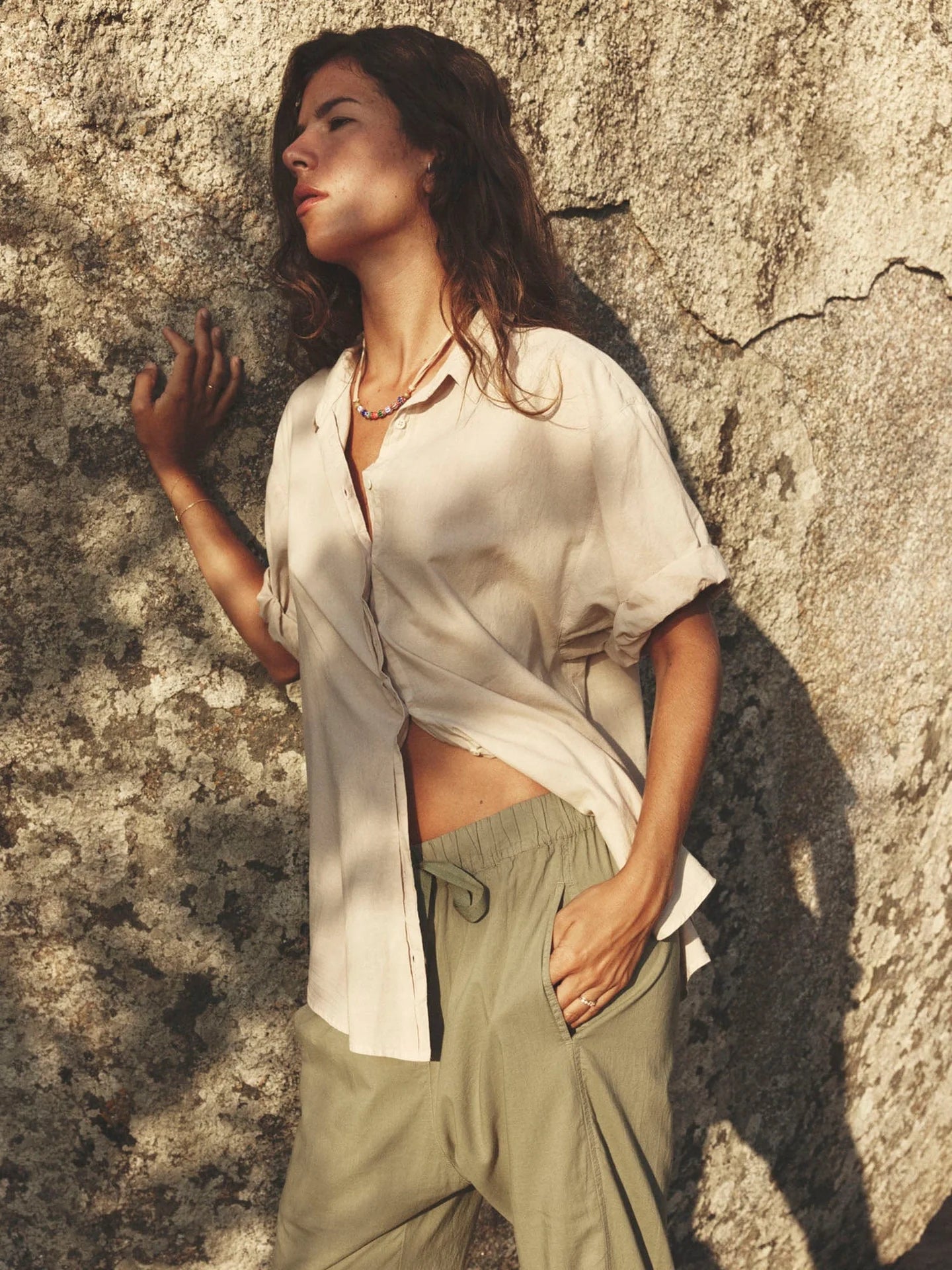 ALT TEXT: The Channing Shirt by Xirena—an oversized cotton button-down with rolled sleeves for an effortlessly cool look.