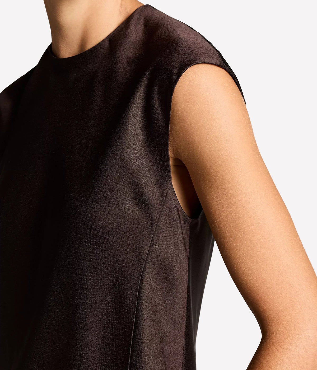 Close-up of the Vince Relaxed Cap Sleeve Top In Cinderwood showing the cap sleeve and the sheen of the fabric at the shoulder