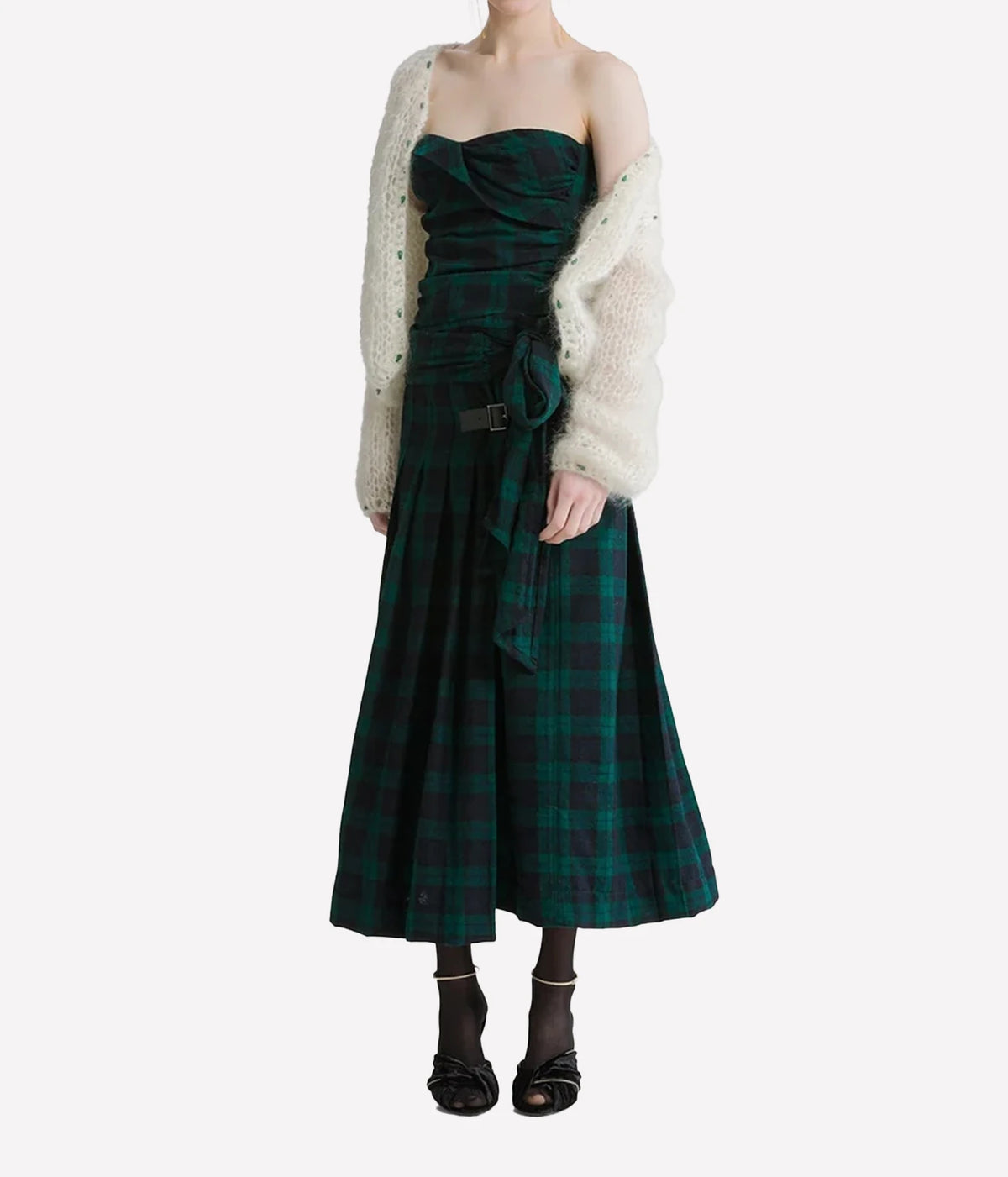 Woman wearing the Forte Forte mohair cardigan in Jewel Ivory with a green tartan midi dress and black boots, full-length front view.