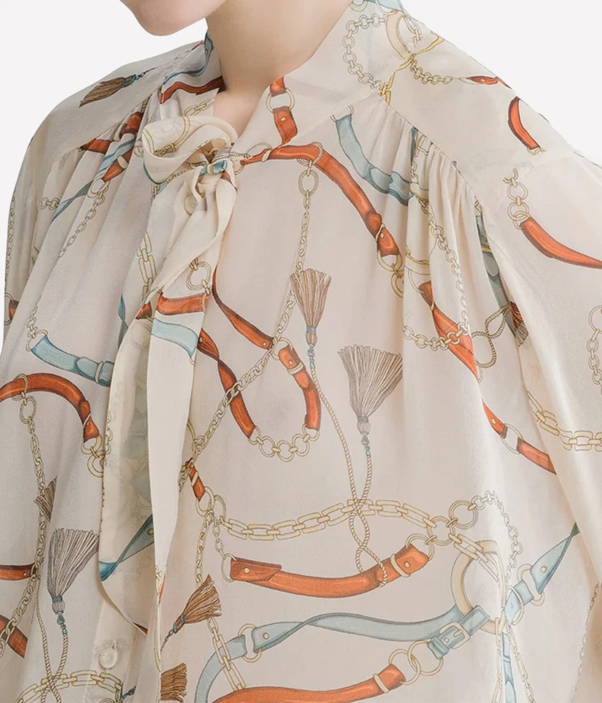 Close-up of the Forte Forte crown print silk shirt in Ivory showing the raised collar, tie sash and print detail.
