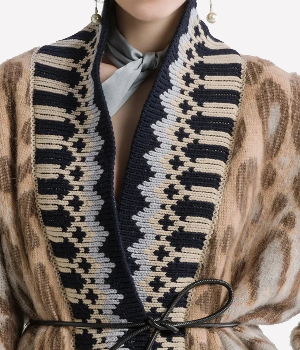 Close-up of the Forte Forte Brit Leopard alpaca cardigan in Gold, showing the fair isle neckline and brushed leopard jacquard.