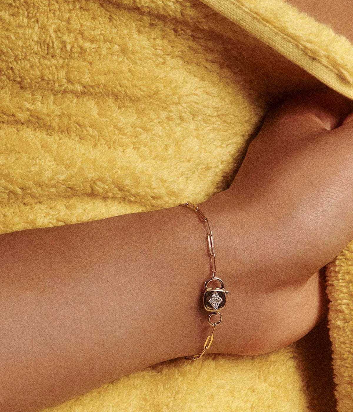 Close-up of a model's wrist wearing the Pascale Monvoisin Louise Bracelet, with the diamond-set clasp sitting on top of the wrist