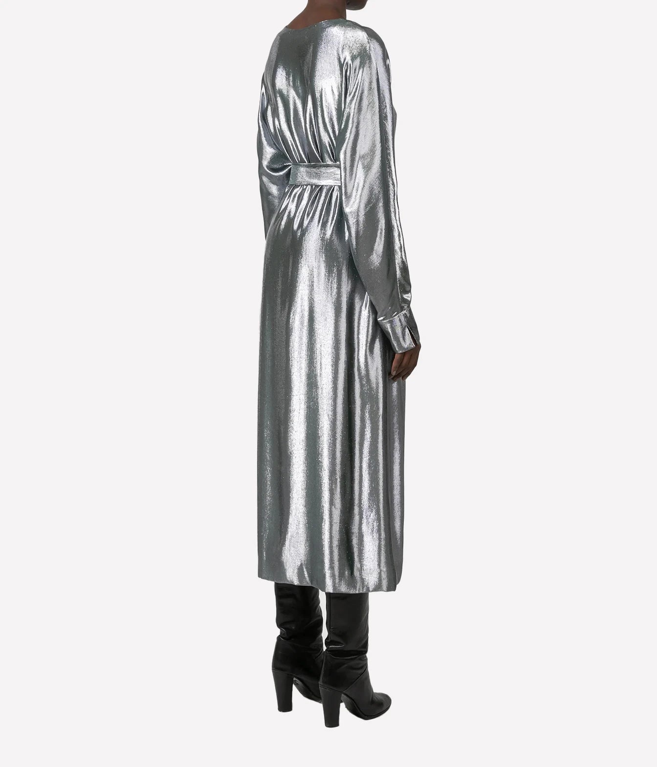 A model shown from the back wearing a long-sleeved metallic silver midi dress with a matching waist tie, paired with black knee-high heeled boots, against a plain light gray background.