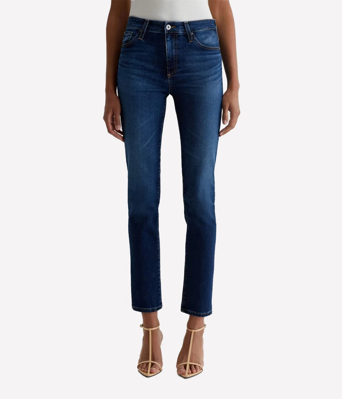 Blue jeans worn by a person on a white background