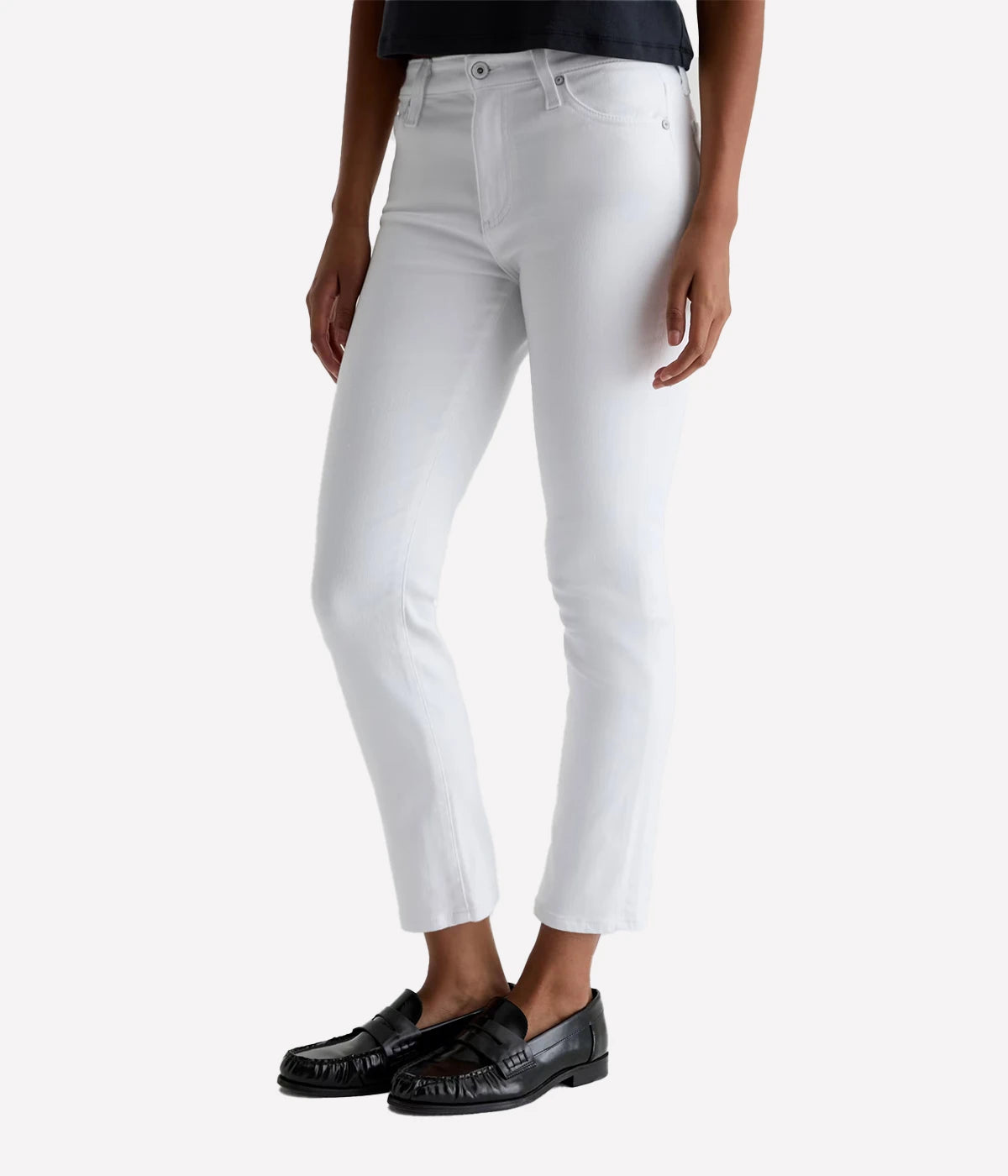 Person wearing white jeans on a white background