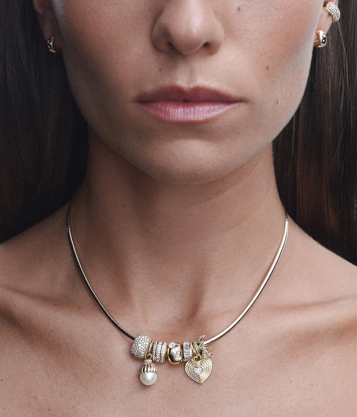 Model wearing the Adina Reyter Pavé Crown Big Bead in 14K Yellow Gold with diamond charms on a gold chain