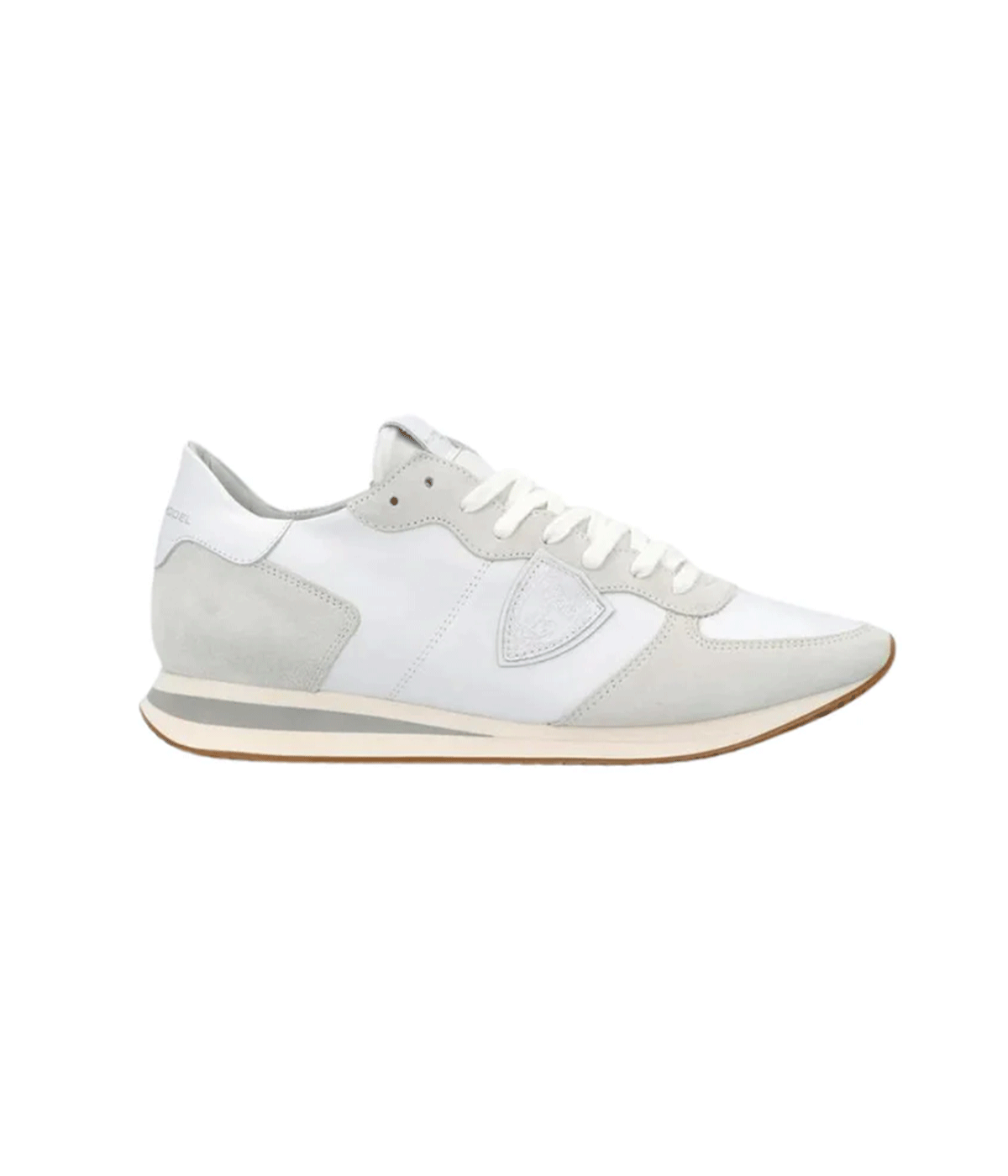 ALT Text: TRPX sneakers with a sinuous sole, crafted from calfskin and suede, showcasing a sleek, modern design with a colour block microporous EVA sole.
