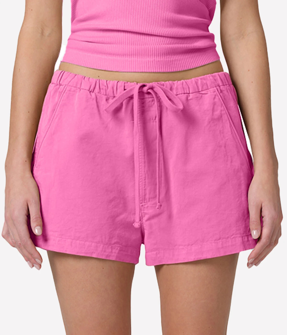 Este Drawstring Short in Raspberry close up of model wearing pink shorts with drawstring - Citizens of Humanity