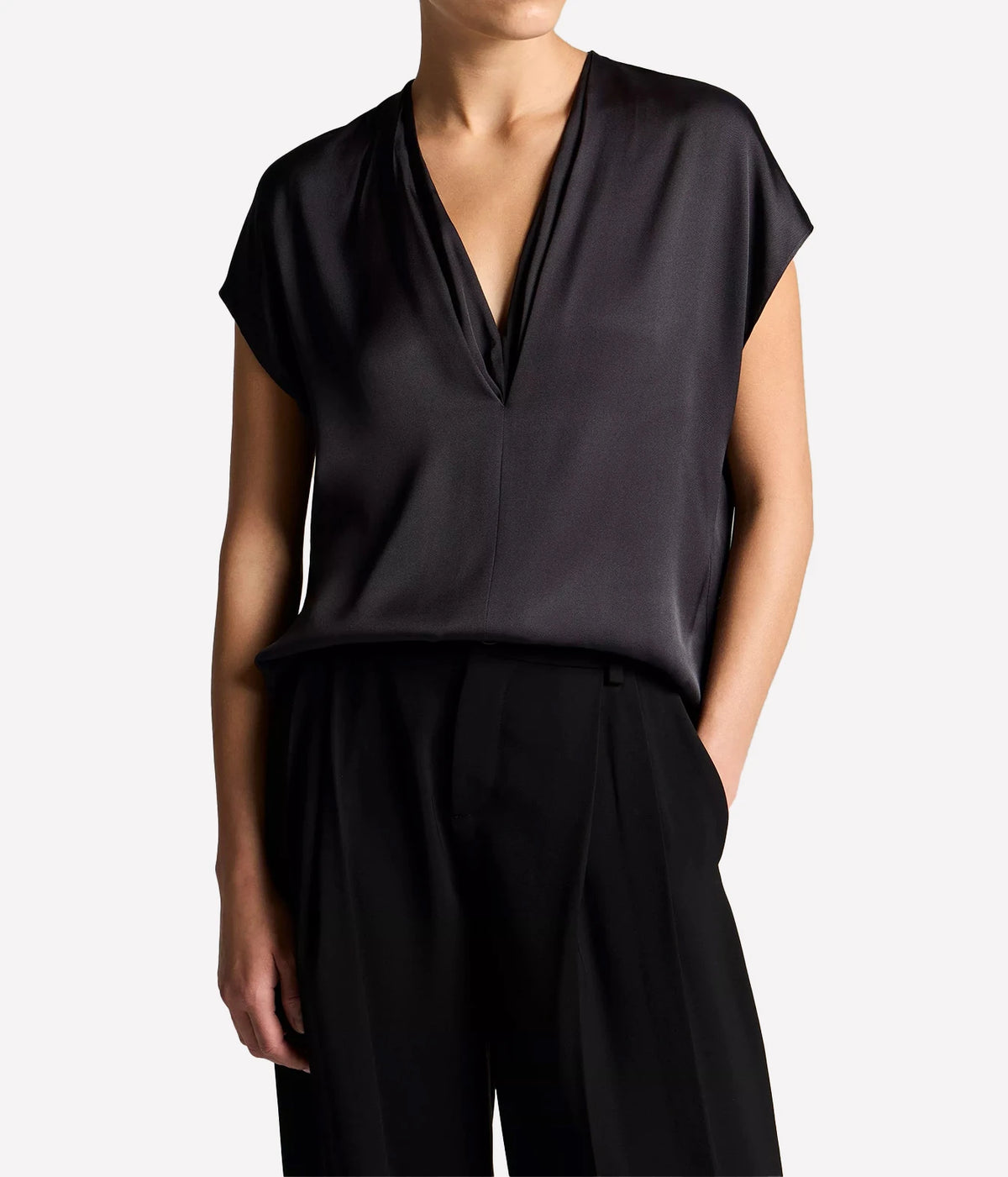 Woman wearing an ink double V-neck shell top, front view