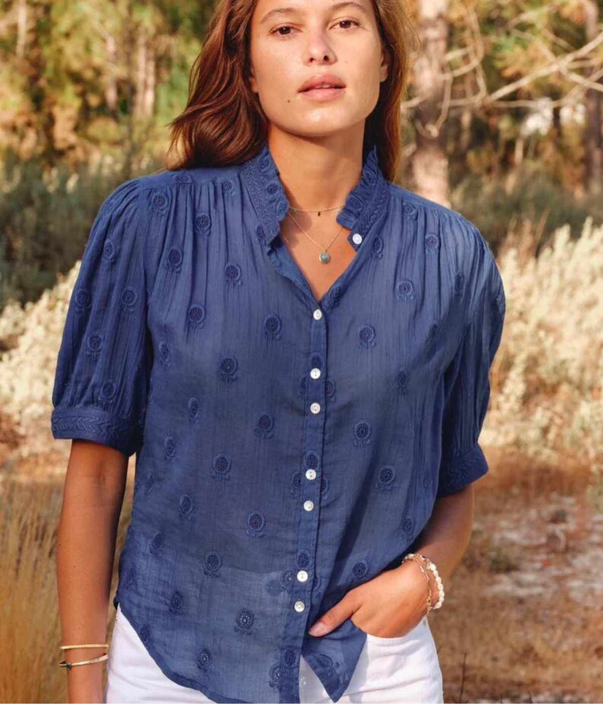 Model wearing the M.A.B.E Frani Embroidered Short Sleeve Top in Indigo outdoors – lifestyle front view