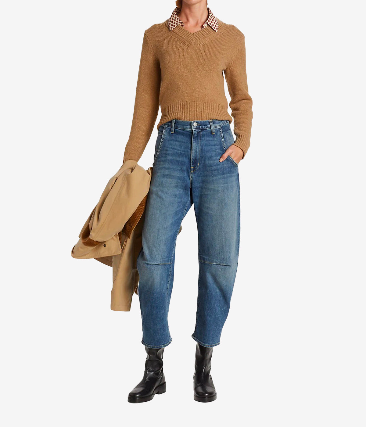 ALT text for images: Barrel silhouette jeans in faded blue denim, with tapered hems and utilitarian pockets, styled for a casual chic look.