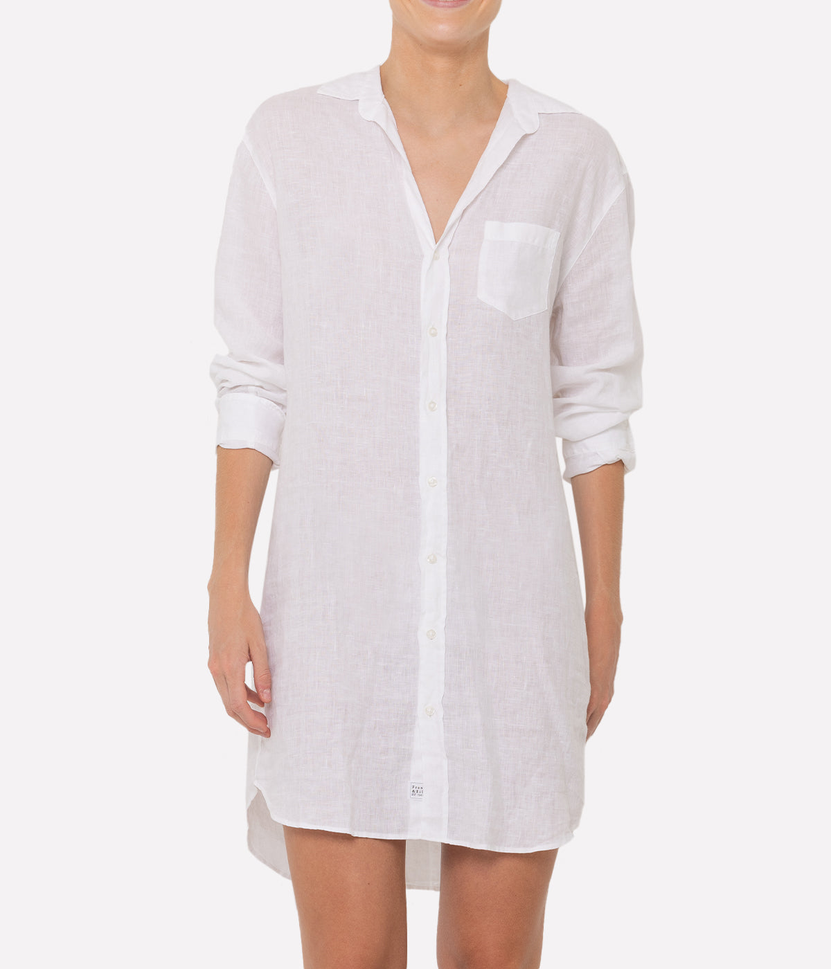 Mary Woven Linen Button-Up Dress from Frank & Eileen, made from 100% linen. Classic shirt dress with a loose silhouette, above-the-knee hemline, and long sleeves. Versatile summer piece, perfect as a beach cover-up or paired with statement sandals for a date night.