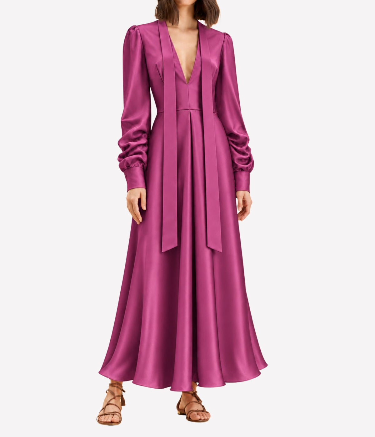 Front view of a model wearing the Raquel Diniz Valerie Dress In Fuchsia with the neck ties falling down the front and tan strappy sandals, showing the full maxi length
