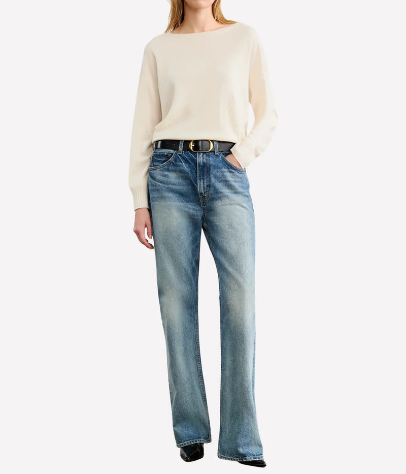 Person wearing a cream sweater and blue jeans on a white background. Nili Lotan Sweater