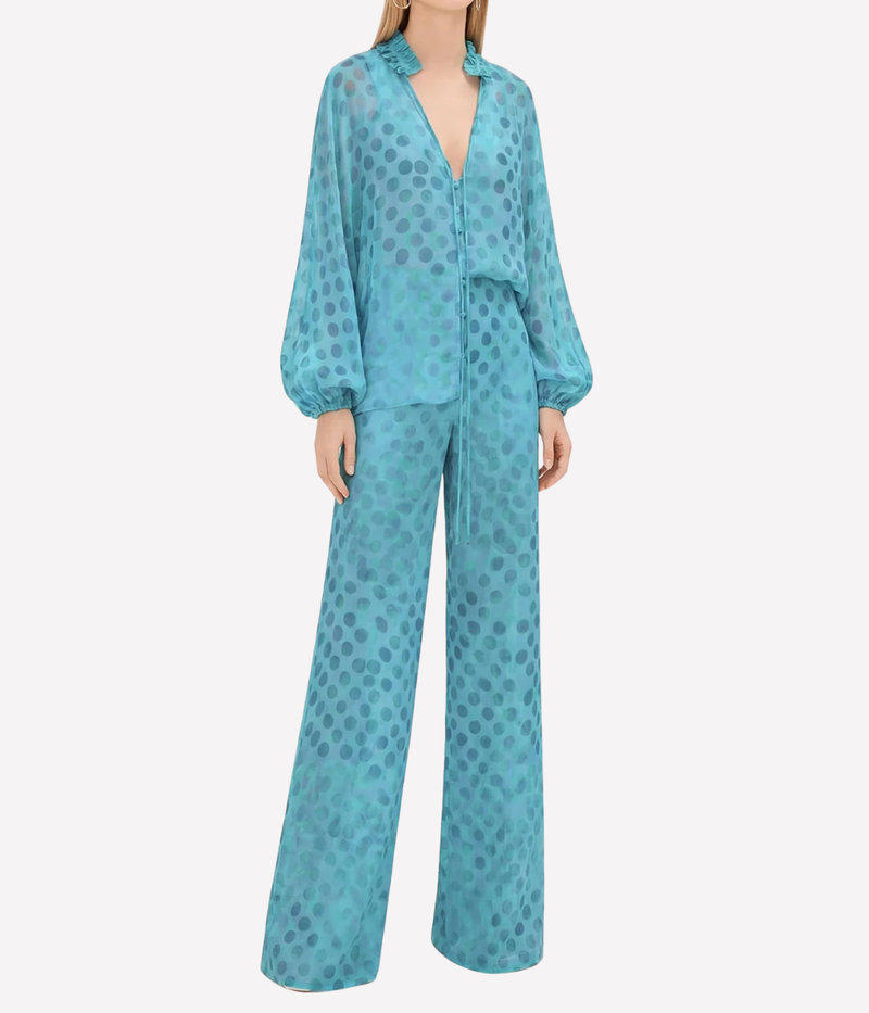 Teal polka dot outfit on a white background