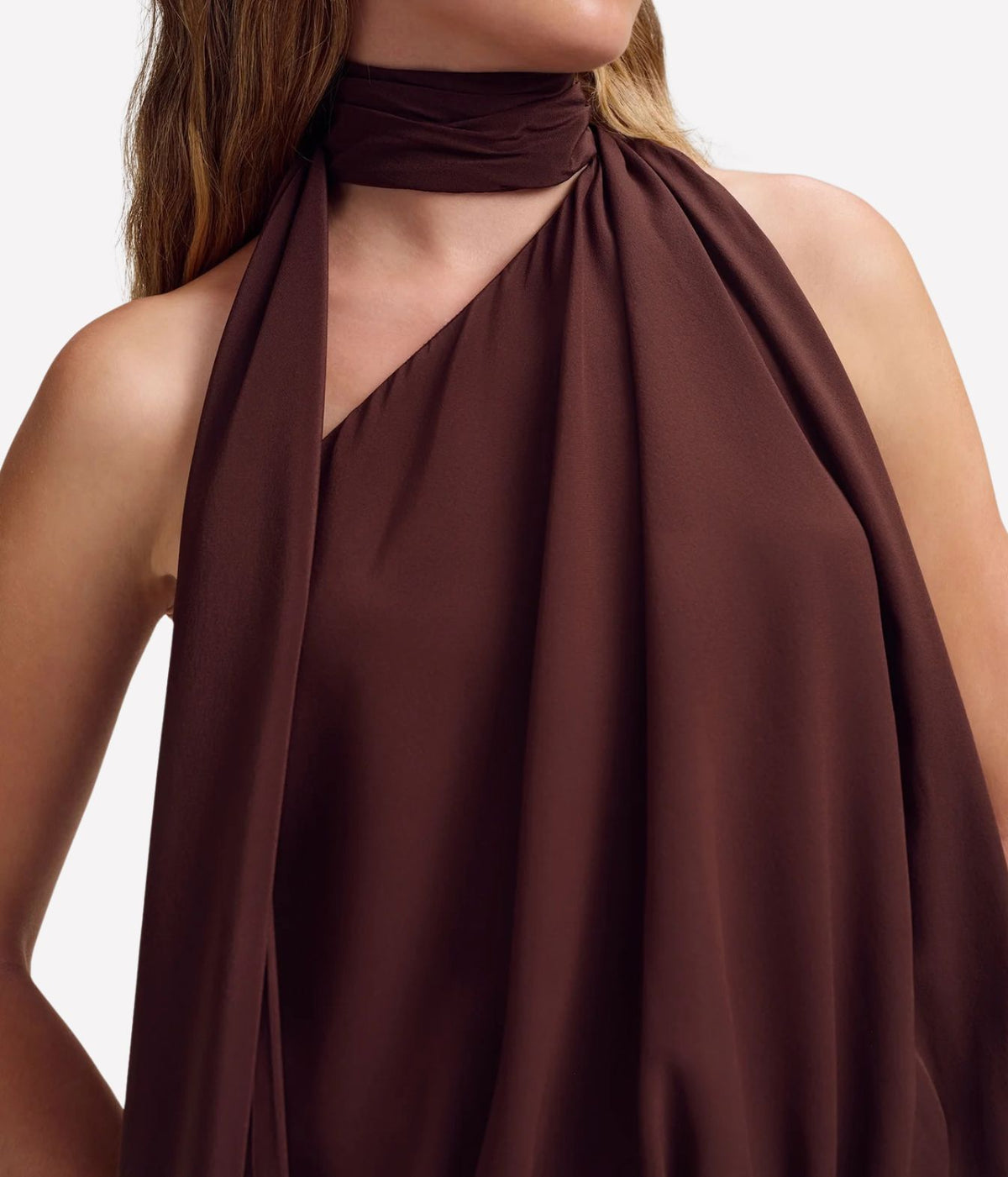 Close-up of the A.L.C. Celeste Top in Coffee on model, showing the wrapped scarf collar, asymmetric one-shoulder neckline and soft fluid drape