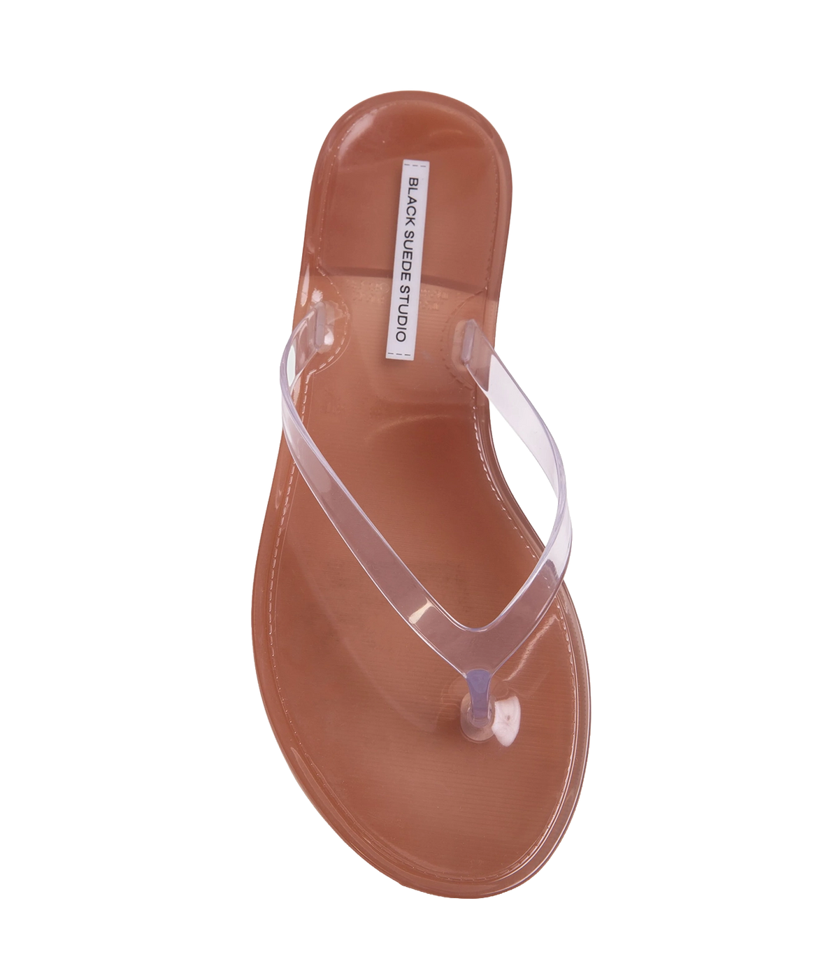 A single transparent jelly thong sandal with a brown footbed, shown from a top-down view - Crystal Sandal in Old Rose