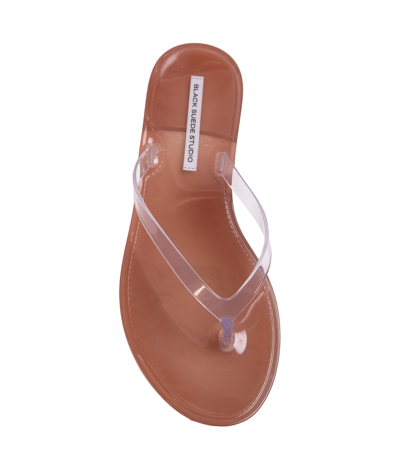A single transparent jelly thong sandal with a brown footbed, shown from a top-down view - Crystal Sandal in Old Rose