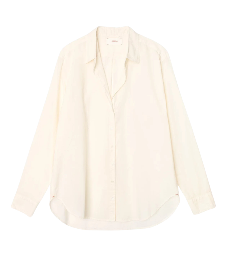 An off-white long-sleeve button-up shirt with a relaxed, oversized fit, laid flat against a solid white background.