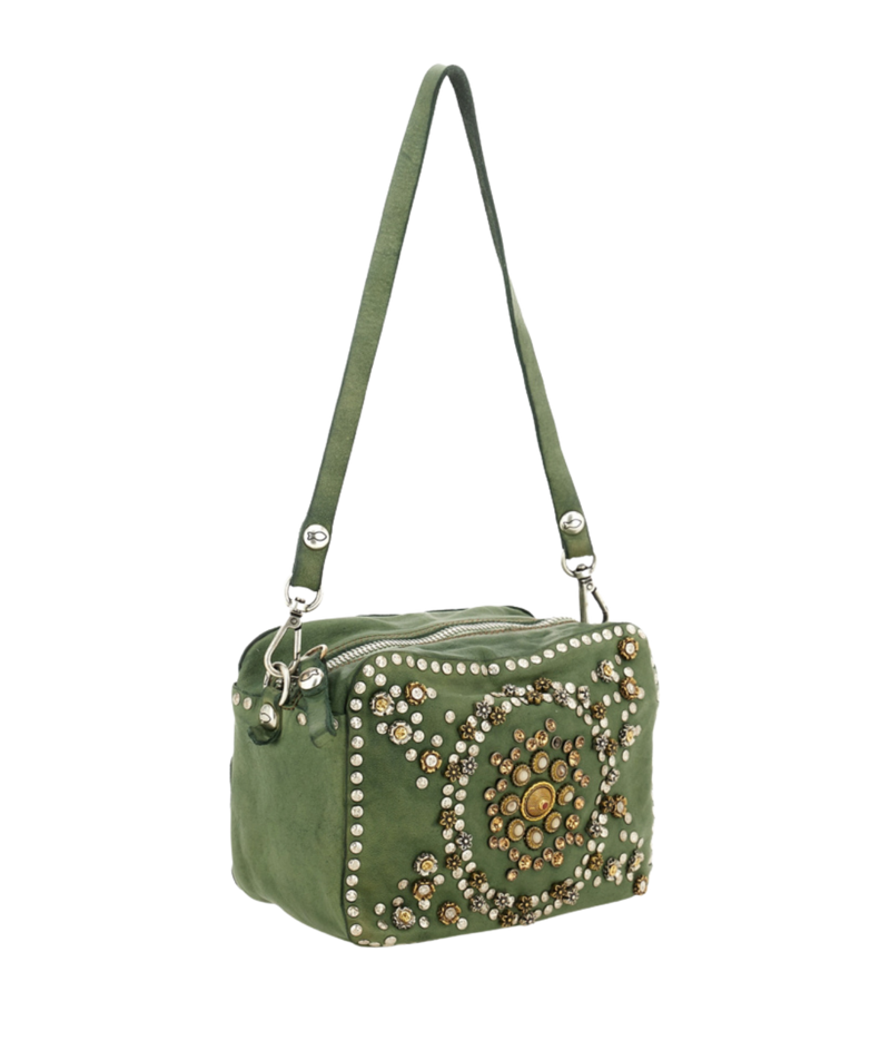 An olive green suede shoulder bag with silver-tone hardware, featuring a large circular floral mandala embellishment on the front face with rhinestones and metallic studs, and a matching green shoulder strap.