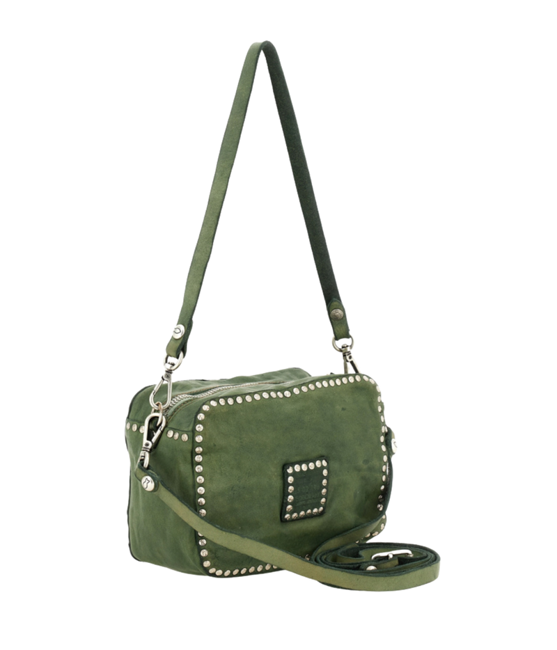 An olive green suede crossbody bag with silver-tone metal studs and hardware, featuring a zippered top and a detachable shoulder strap, shown against a plain white background.