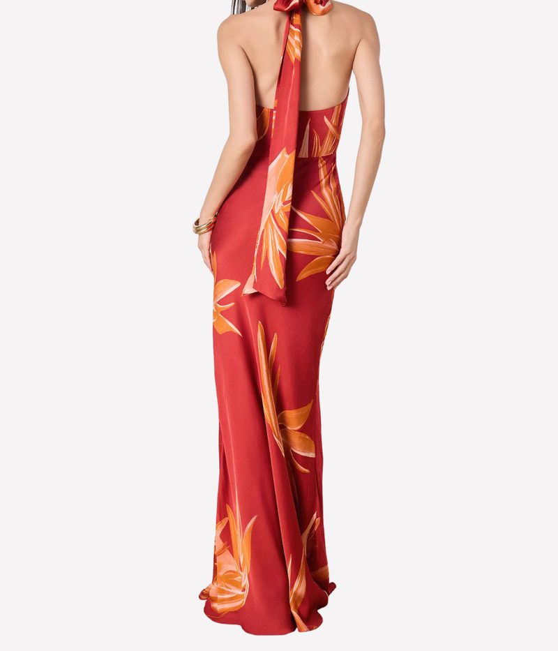 Red halter neck gown with orange floral pattern on a white background