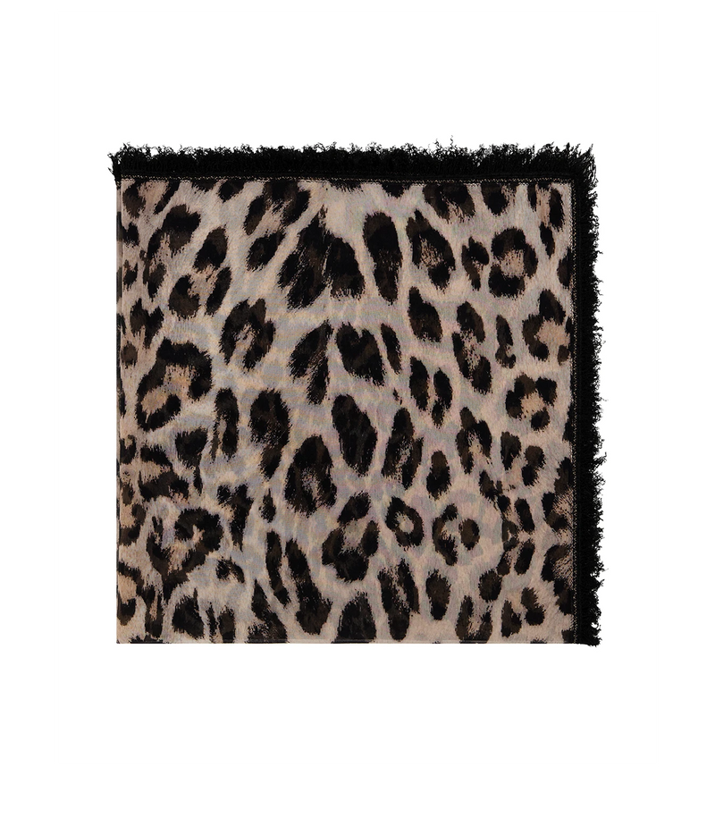 A square scarf with a black leopard print pattern on a beige background, finished with a black fringed border, shown flat against a white background.