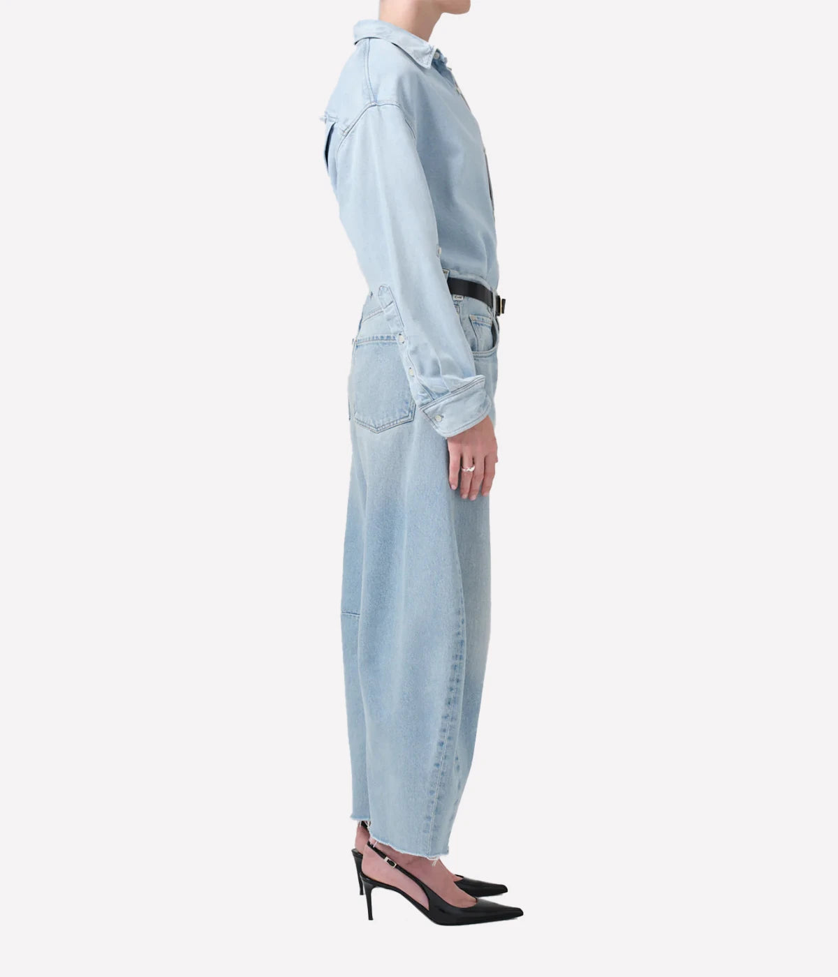 ALT Text: Light indigo cropped jeans with a curved wide-leg silhouette and frayed hems.