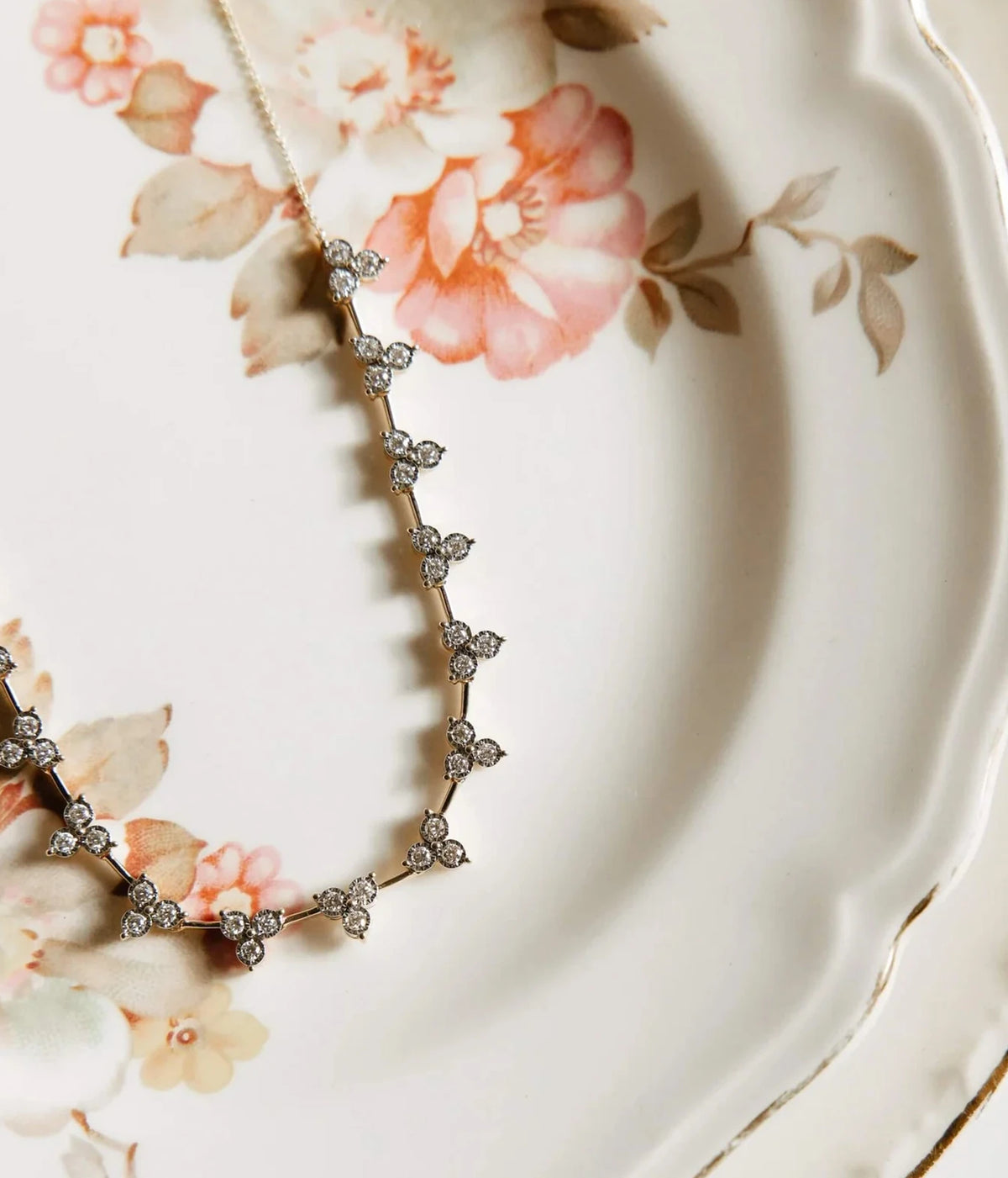 Dana Rebecca Designs Ava Bea Interval Trio Tennis Necklace in 14k Yellow Gold arranged in a gentle curve, highlighting the trio diamond clusters and gold links