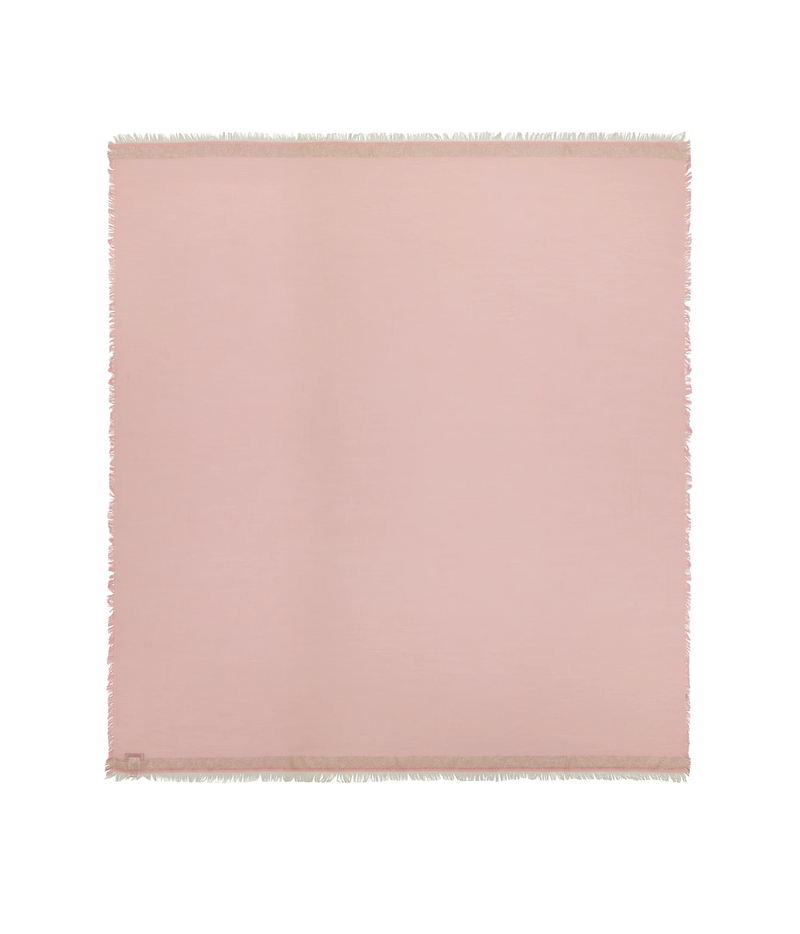 A square blush pink fabric throw blanket with fringed edges, displayed flat against a solid white background.