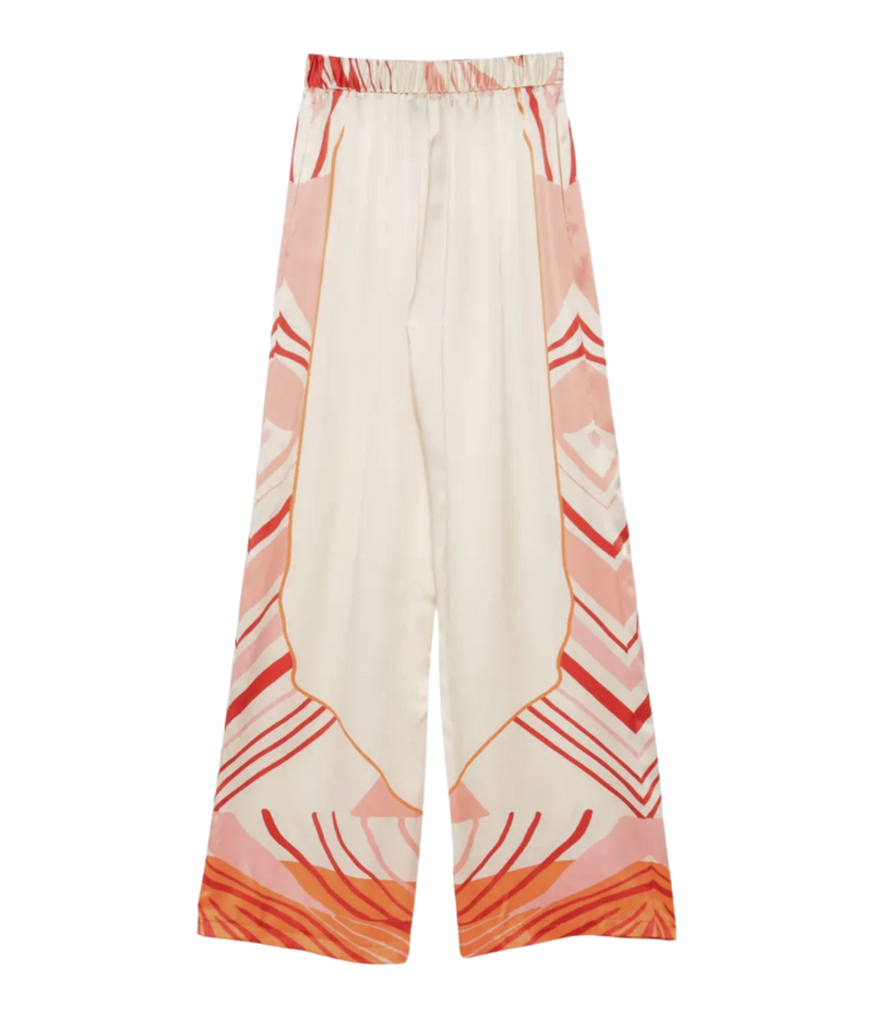 White pants with red and orange geometric pattern on a white background