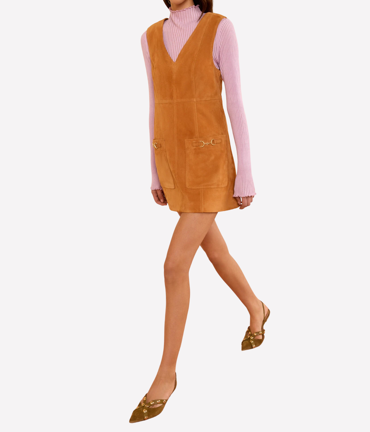 Ulla Johnson Sloane Suede Mini Dress in Cognac brown, side view on a walking model showing the short hem and fitted bodice.