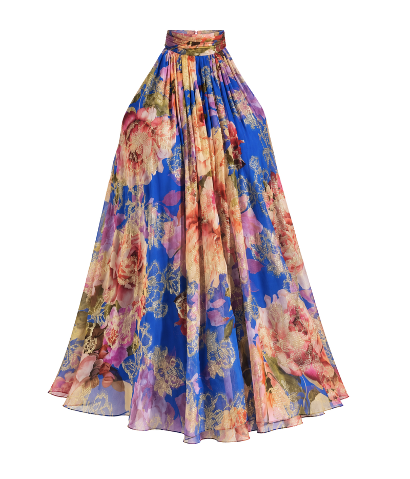 A high-waisted, full-length pleated skirt featuring a vibrant blue base with a large, multicolored floral print in shades of pink, orange, yellow, and purple, complete with a matching waistband.