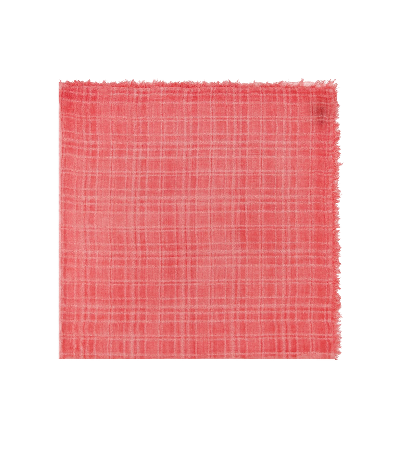 A square piece of coral pink woven fabric with a subtle plaid pattern and frayed edges, displayed flat against a solid white background.