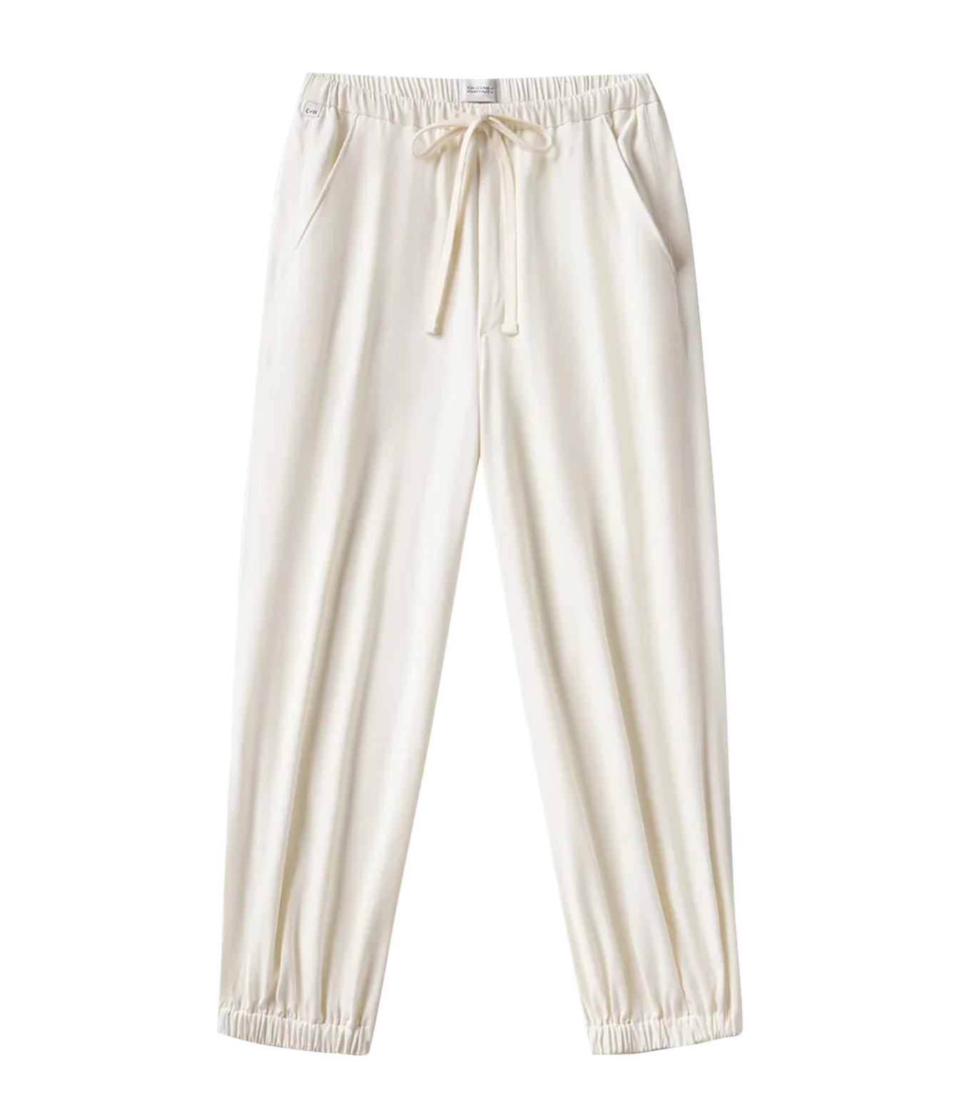 Cream-colored lounge pants with an elastic waistband, drawstring, and elastic cuffs, shown against a plain white background.