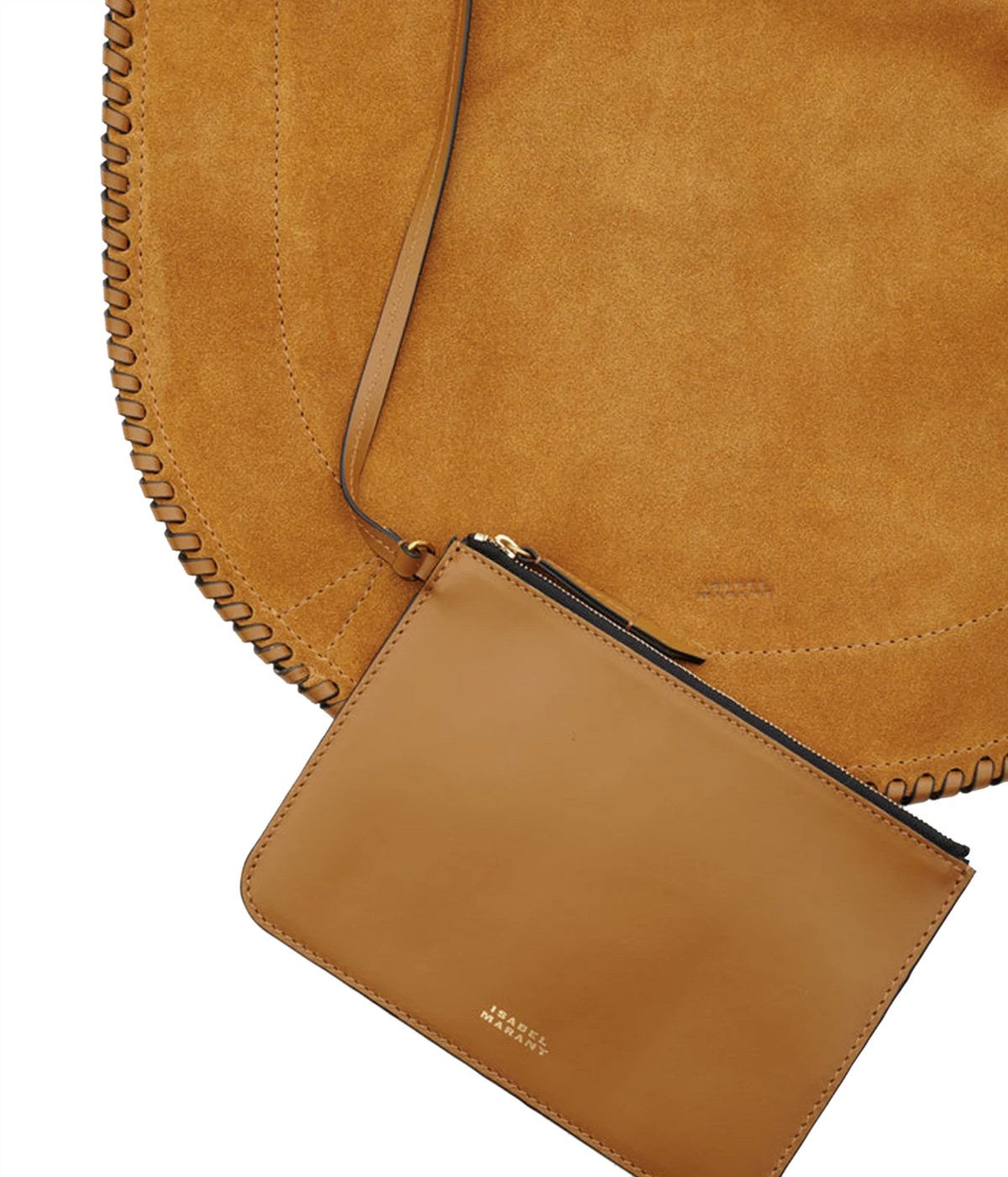 A close-up studio shot of a tan leather pouch with a black zipper and gold logo, attached to a large tan suede shoulder bag with whipstitching - Oskan Hobo Soft Bag In Cognac