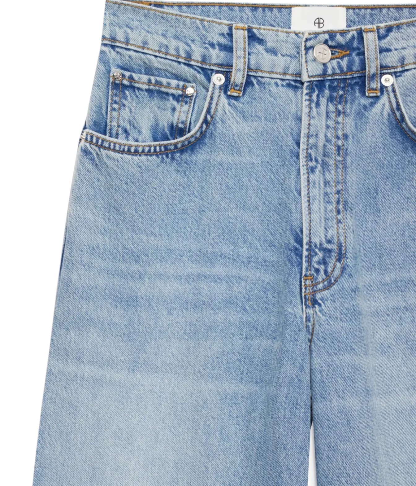Close-up of a pair of light blue denim jeans showing the front waistband, belt loops, button, pocket, and fabric texture on a white background.