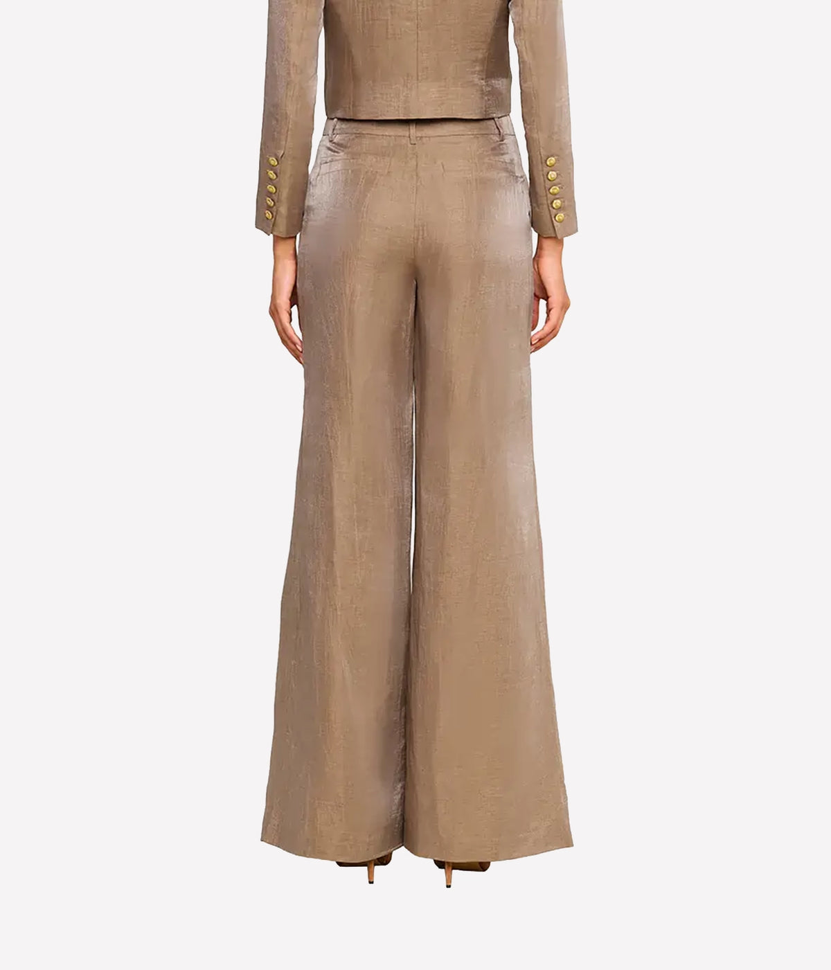 Back view of a model wearing the Allanah Linen-Blend Trouser with the matching Inez Cropped Blazer in Latte & Gold, highlighting the gold cuff buttons.