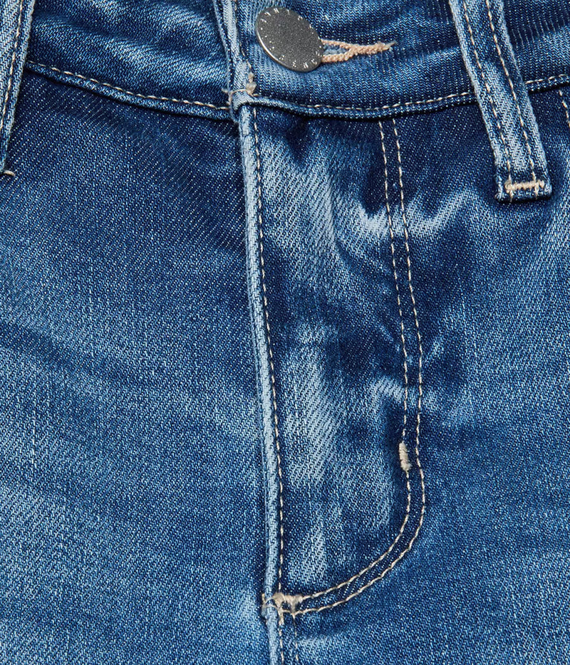 Close-up of the L'AGENCE Scottie Wide-Leg Denim Jean in Cambridge showing the waistband, button closure, belt loops, front seam, and pocket stitching.