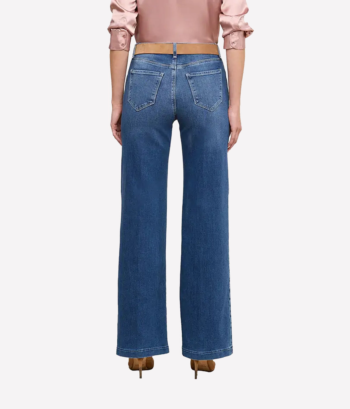 A model shown from the back wearing the L'AGENCE Scottie Wide-Leg Denim Jean in Cambridge, a light pink blouse, and brown heels.