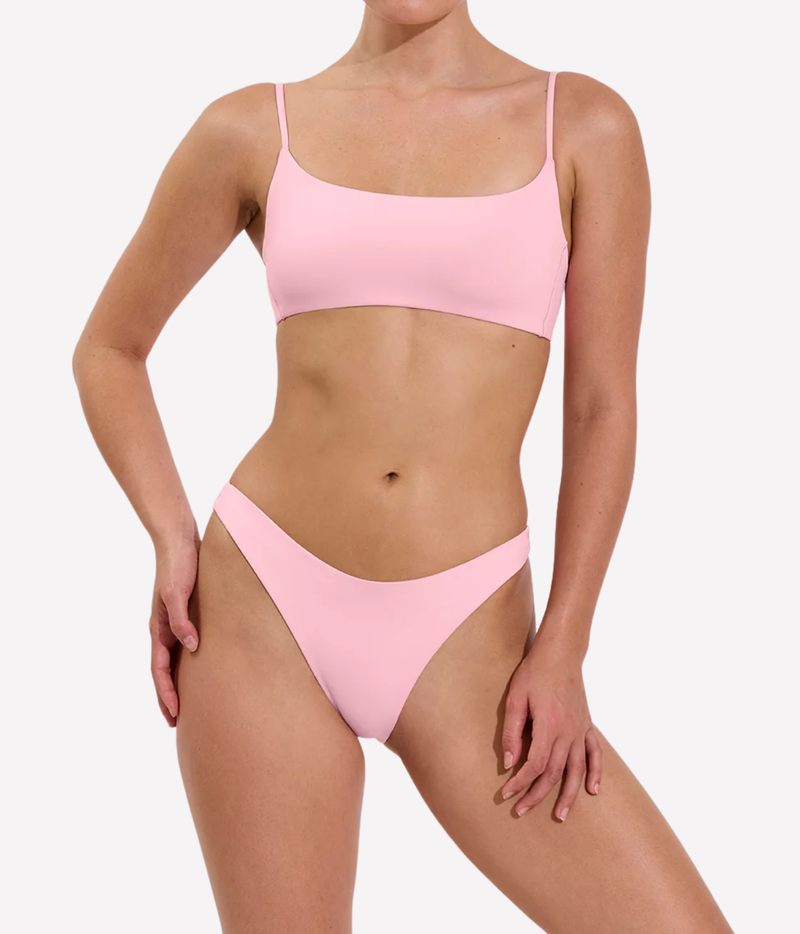 A model wearing a light pink two-piece bikini set - Left On Friday, Dip Bottom In Delight
