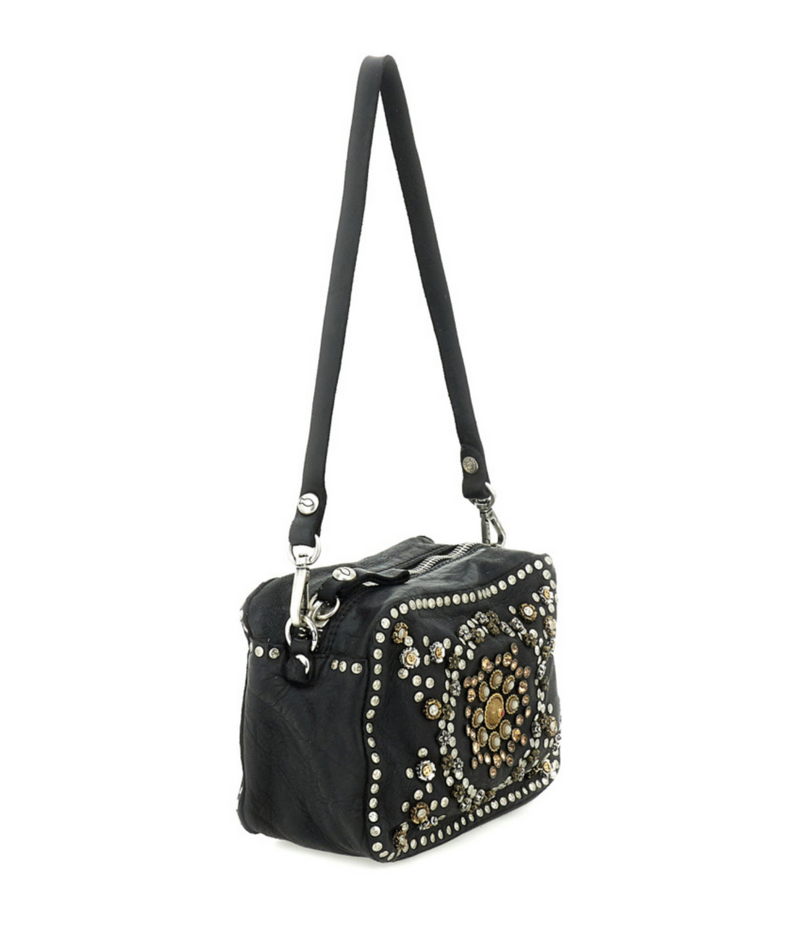 A black leather shoulder bag with a long strap, decorated with silver studs and a large gold floral pattern on the front, shown against a plain white background.